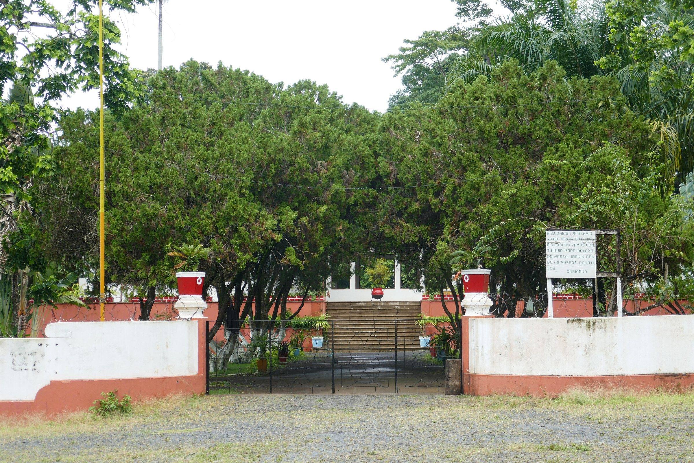 The gated entrance and gardens of Roça Agostinho Neto